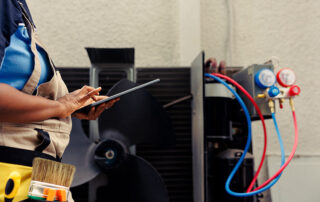 tech fixing hvac system