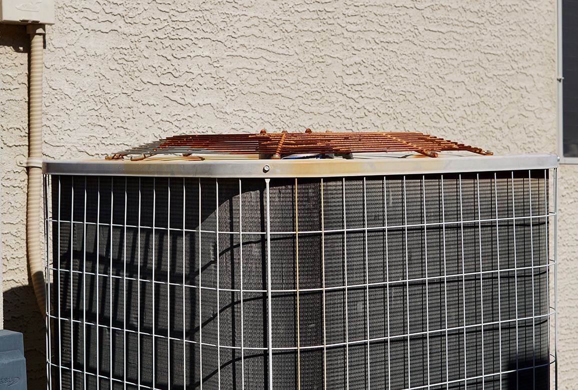 old air conditioning unit with rust on top